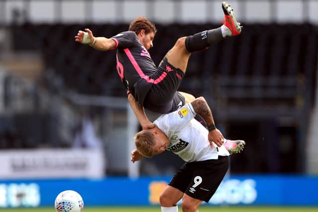 Leeds United's Gaetano Berardi (top) fouls Derby County's Martyn Waghorn (Picture: PA)