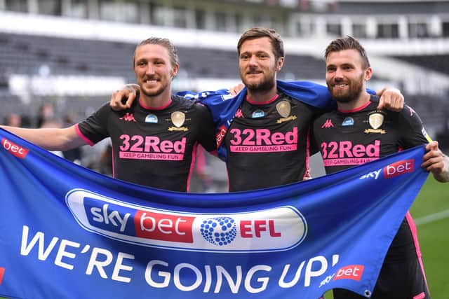 Luke Ayling of Leeds United, Stuart Dallas of Leeds United and Liam Cooper of Leeds United celebrate after winning the Championship. (Picture: Laurence Griffiths/Getty Images)