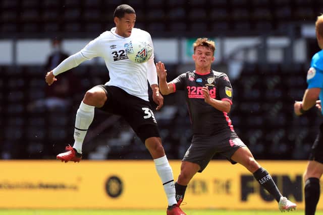 Derby County's Curtis Davies (left) and Leeds United's Jamie Shackleton battle for the ball (Picture: PA)