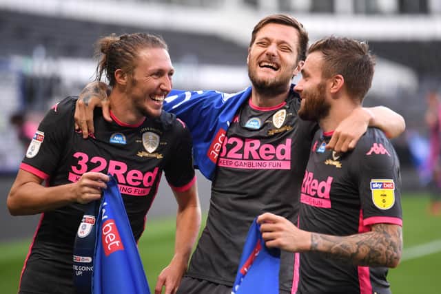 Just champion: Luke Ayling of Leeds United, Stuart Dallas of Leeds United and Liam Cooper of Leeds United celebrate. (Picture: Laurence Griffiths/Getty Images)
