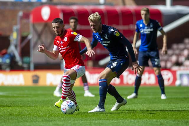 Barnsley's Connor Chaplin with Forest's Joe Worrall. (Picture: Tony Johnson)