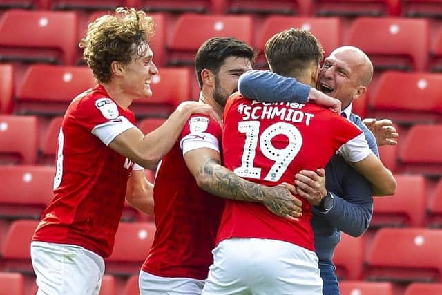 Barnsley manager Gerhard Struber celebrates with  substitute Patrick Schmidt after he grabbed a late winning goal. (Picture: Tony Johnson)