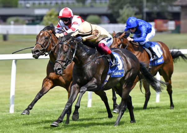 ESHER, ENGLAND - JULY 05: A'Ali and jockey Frankie Dettori wins the Coral Charge  at Sandown Park Racecourse on July 05, 2020 in Esher, England. (Photo by Francesca Altoft/Pool via Getty Images)