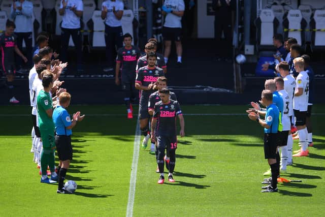 Derby line up to give a a guard of honor for Leeds United players to honor their title ahead. (Picture: Laurence Griffiths/Getty Images)