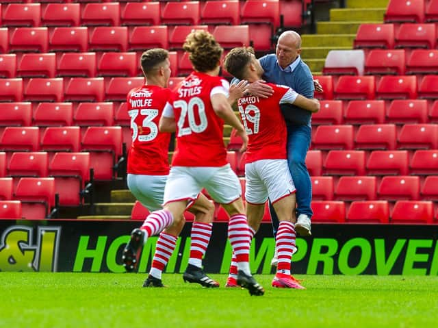 Barnsley head coach Gerhard Struber celebrates with Patrick Schmidt and his Reds players after Sunday's dramatic late win. PICTURE: TONY JOHNSON.
