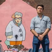 Mike Scown, Pottery Manager of The Art House, Sheffield, in front of the Pete McKee mural 'Murial', which covers one of building's walls. A limited edition print of Muriel has been donated by McKee for the auction. Picture James Hardisty.