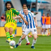 Ahmed Hegazi clears from Lewis O'Brien of Huddersfield Town (Picture: Bruce Rollinson)