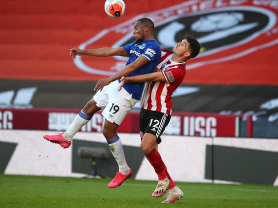 CHALLENGE: John Egan competes for the ball with Everton's Djibril Sidebe