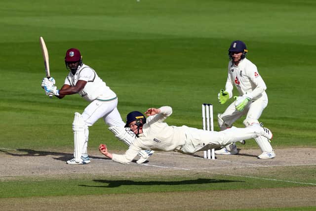 MAGIC MOMENT: England's Ollie Pope takes the winning catch to dismiss West Indies' Kemar Roach at Old Trafford. Picture: Michael Steele/NMC Pool/PA