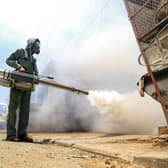 A government worker that is part of a combined taskforce tackling COVID-19 coronavirus fumigates a neighbourhood as part of safety precautions, in Yemen's capital Sanaa.