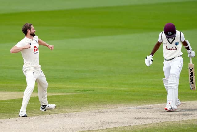 IN CONTENTION: England's Chris Woakes celebrates taking the wicket of West Indies' Kraigg Brathwaite at Old Trafford. Picture: Jon Super/NMC Pool/PA