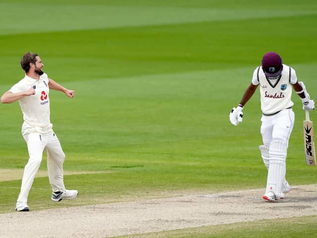 IN CONTENTION: England's Chris Woakes celebrates taking the wicket of West Indies' Kraigg Brathwaite at Old Trafford. Picture: Jon Super/NMC Pool/PA