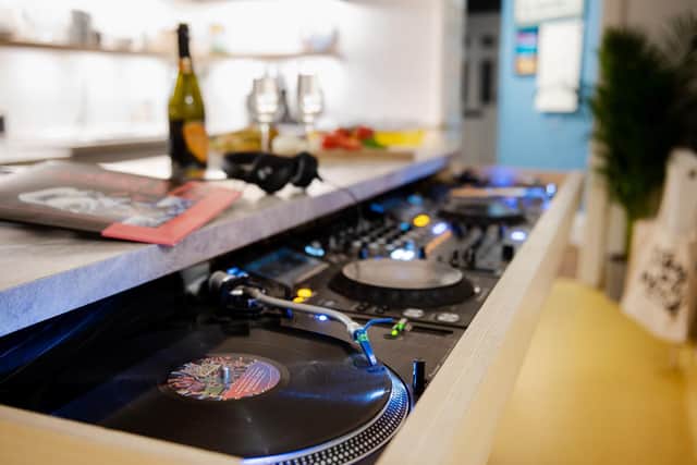 The kitchen island with built in record deck is known as "the party island"