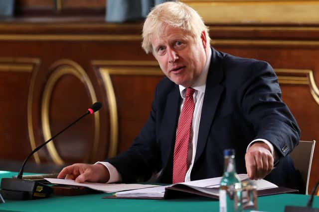Boris Johnson during this week's Cabinet meeting which was held in the Foreign and Commonwealth Office so that social distancing could be applied.