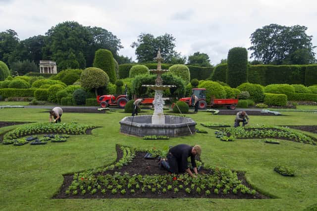 The garden team at English Heritage site Brodsworth Hall near Doncaster plant up the flower beds ready for reopening in June following the coronavirus lockdown. Picture Tony Johnson