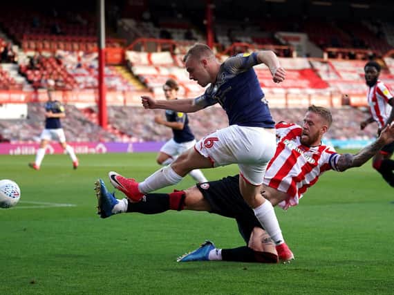 Luke Thomas on the attack for Barnsley at Brentford. Picture:  John Walton/PA.