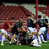 Gerhard Struber (far right) celebrates with his Barnsley FC players after a dramatic late win at Brentford. Picture: Getty Images.