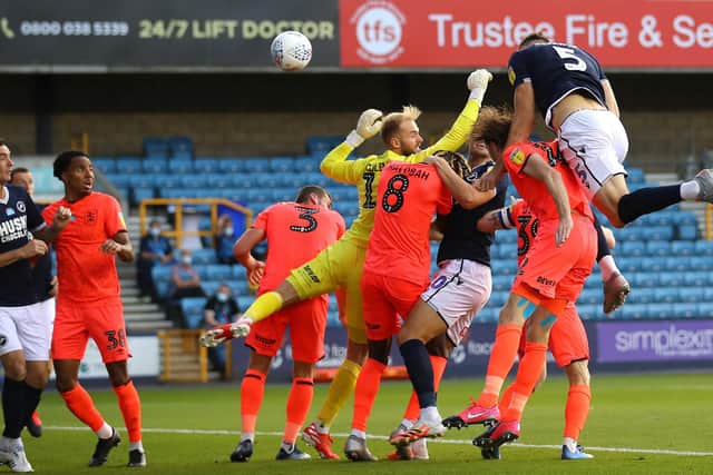 GO-AHEAD GOAL: Jake Cooper scores Millwall's second goal against Huddersfield at The Den Picture: Warren Little/Getty Images