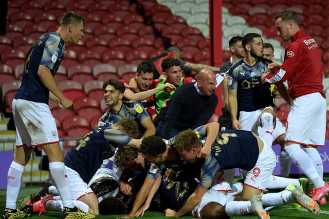 Barnsley players, and manager Gerhard Struber celebrate Clark Odour's dramatic late goal (PIcture: Getty Images)