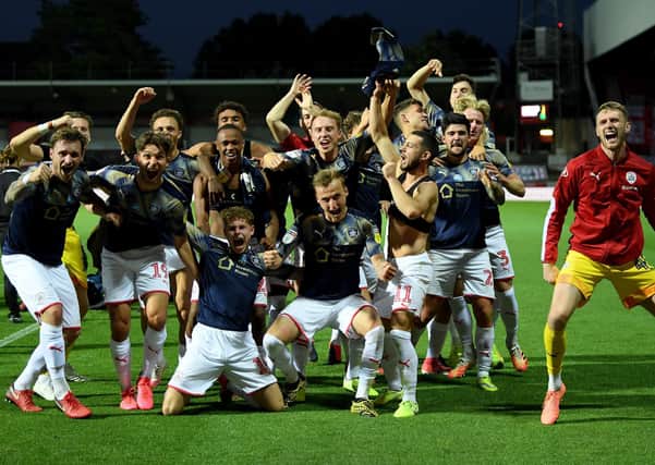 The team of Barnsley celebrate staying up after the Sky Bet Championship match between Brentford and Barnsley at Griffin Park on July 22, 2020 (Picture: Mike Hewitt/Getty Images)