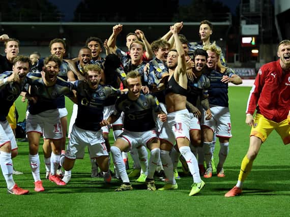 Jubilant Barnsley players celebrate after their dramatic win at Brentford. Picture: Getty Images.
