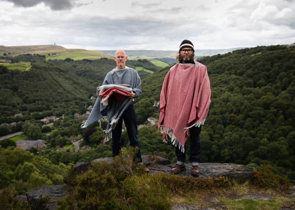 Hebtroco co-founders Brant Richards, left, and Ed Oxley, at Hell Hole Rocks, near Heptonstall, with Stoodley Pike in the background. Both wear Action blankets, £95, and selvedge denim jeans, £150. Picture by Alex De Palma.