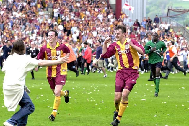 Bradford's David Wetherall (right) runs off alongside team-mate Andy O'Brien after his goal against Liverpool kept the Bantams in the Premiership back in May 2000. Picture: John Giles/PA.