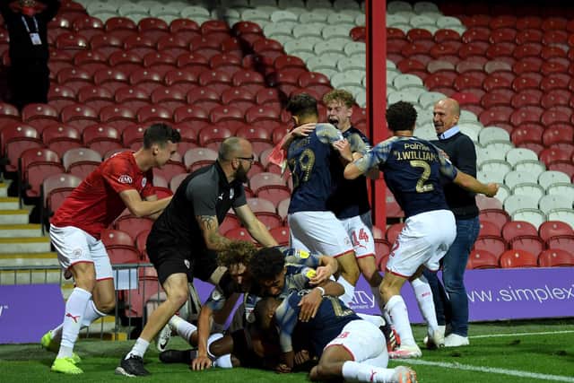 Clarke Oduor of Barnsley celebrate with his team-mates after he scores the goal that saved them from relegation (Picture: Getty Images)