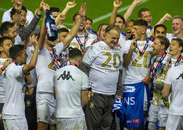 Just champion: Marcelo Bielsa, centre, got Leeds playing a certain way this season and they stuck to it, resulting in the Championship title and promotion to the Premier League. (Picture: Tony Johnson)