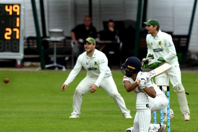 Driving force: Azeem Rafiq of Cleckheaton on the drive against New Farnley.