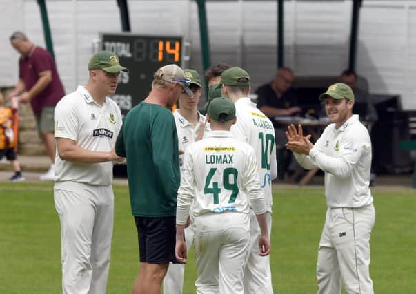 New normal: New Farnley players taking a hand gel break in the game  against Cleckheaton, who reached 194-6 before the hosts won at 196-5 in their Bradford League encounter. Pictures: Gary Longbottom