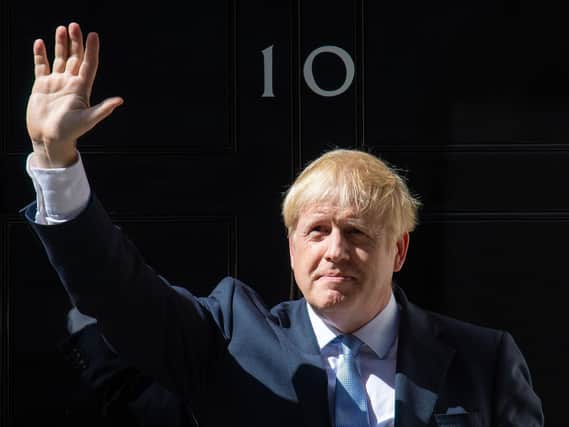 Prime Minister Boris Johnson waving outside 10 Downing Street, London, after meeting Queen Elizabeth II and accepting her invitation to become Prime Minister and form a new government in July 2019. Picture: Dominic Lipinski/PA Wire