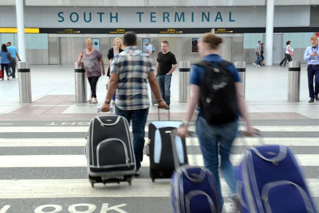 Library image of airline passengers. The pandemic has caused major disruption to global travel.