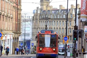 Sheffield Supertram heading up Church Street in Sheffield. Pic by Chris Etchells