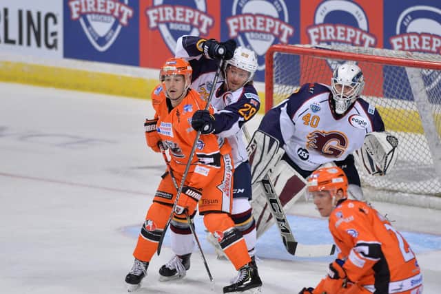 HARD AREAS: Tanner Eberle gets himself in the firing line against Guildford Flames. Picture: Dean Woolley.