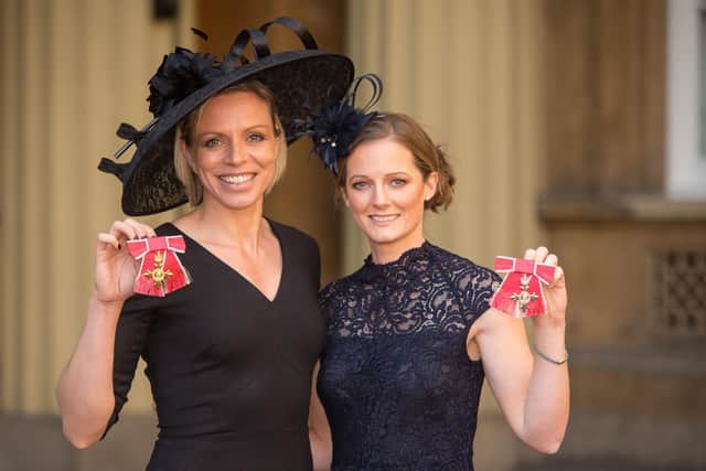Former Great Britain hockey captain Kate Richardson-Walsh (left) and her wife Helen, at Buckingham Palace, London, after the investiture ceremony where they received an OBE and MBE respectively from the Prince of Wales for helping the national team win gold at the Rio Olympics. Picture: Dominic Lipinski/PA.