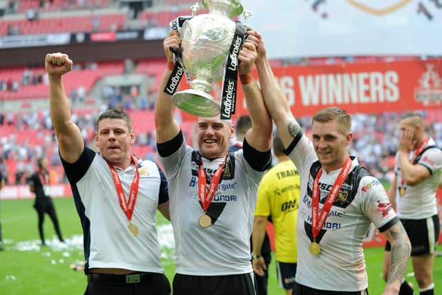 GOOD TIMES: Hull FC's Lee Radford, Gareth Ellis and Marc Sneyd, right, celebrate winning the Challenge Cup against Warrington in August 2016. Picture: Jonathan Gawthorpe