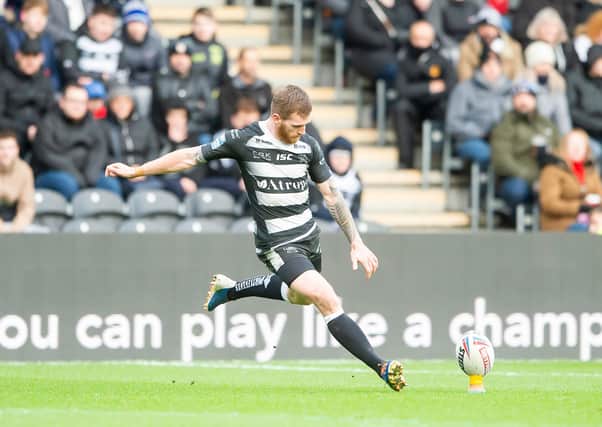 Hull FC's Marc Sneyd kicks for goal against St Helens in February. Picture by Allan McKenzie/SWpix.com