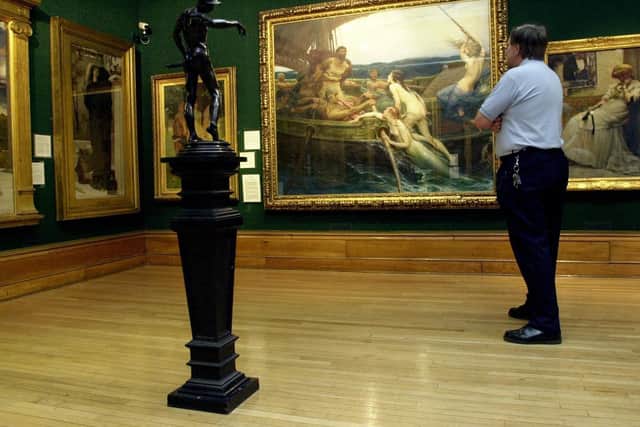 Archive pic: A member of staff admires Herbert Draper's Ulysses and the Sirens at the Ferens Art Gallery, Hull (2001)