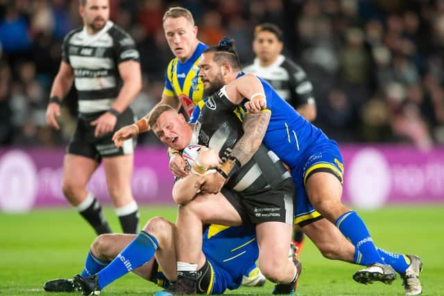 LOW POINT: Hull FC's Jack Brown is tackled by Warrington's Ben Murdoch-Masila during the home side's 38-4 defeat at the KCOM Stadium earlier this year. Picture by Allan McKenzie/SWpix.com