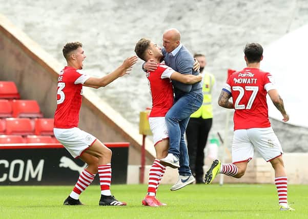Barnsley's Patrick Schmidt (second left) celebrates scoring his sides first goal of the game with Barnsley manager Gerhard Struber during the Sky Bet Championship match at Oakwell, Barnsley. PA Photo. Issue date: Sunday July 19, 2020. See PA story SOCCER Barnsley. Photo credit should read: Martin Rickett/PA Wire. RESTRICTIONS: EDITORIAL USE ONLY No use with unauthorised audio, video, data, fixture lists, club/league logos or "live" services. Online in-match use limited to 120 images, no video emulation. No use in betting, games or single club/league/player publications.