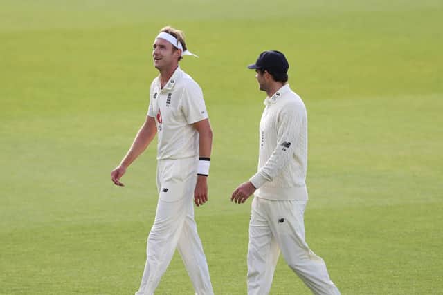 England's Stuart Broad (left) and James Anderson chat at the end of play on day three of the Third Test at Emirates Old Trafford. Picture: Martin Rickett/NMC Pool/PA