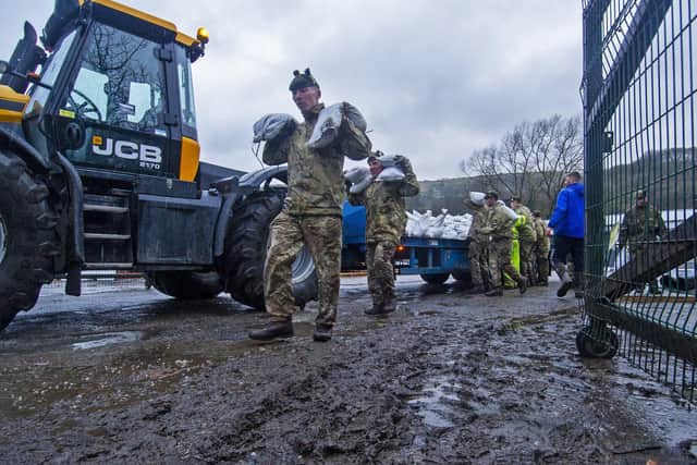 Soldiers from the Highlanders based at Catterick Garrison help build flood defences in Mytholmroyd inn the Calder Valley in preparation for Storm Dennis in February. Picture Tony Johnson