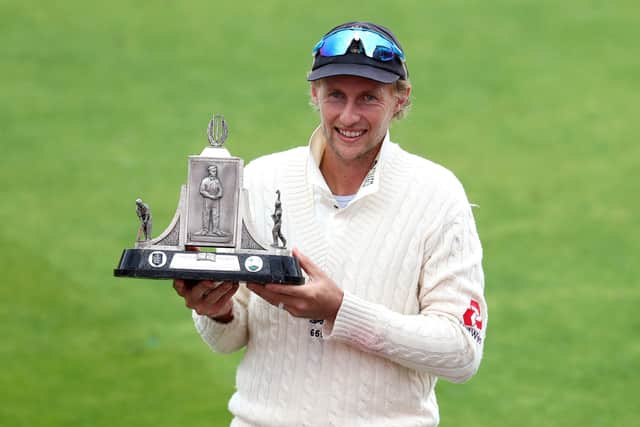 England's Joe Root celebrates their series victory with the Wisden Trophy during day five of the Third Test at Emirates Old Trafford, Manchester. PA Photo. Issue date: Tuesday July 28, 2020. See PA story CRICKET England. Photo credit should read: Martin Rickett/NMC Pool/PA Wire. RESTRICTIONS: Editorial use only. No commercial use without prior written consent of the ECB. Still image use only. No moving images to emulate broadcast. No removing or obscuring of sponsor logos.
