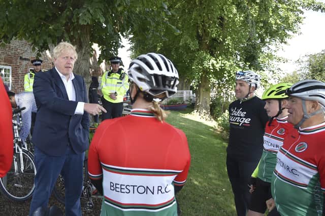 Prime Minister Boris Johnson meets members of a local cycling club at the Canal Side Heritage Centre in Beeston near Nottingham to launch of a strategy to get more people cycling.