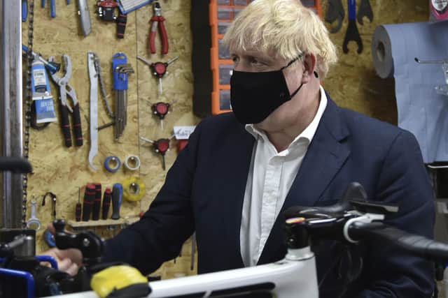 Prime Minister Boris Johnson during a visit to the Cycle Lounge, a bicycle repair shop in Beeston, Nottinghamshire, to launch a strategy to get more people cycling.