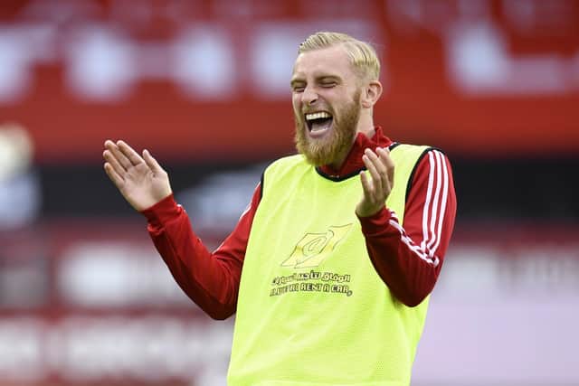 IMPROVEMENT: Sheffield United's Oliver McBurnie has a joke during warm up at Bramall lane. Picture: Peter Powell/NMC Pool/PA