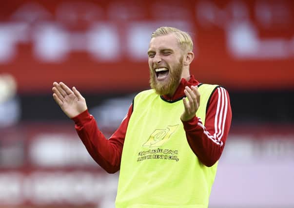 IMPROVEMENT: Sheffield United's Oliver McBurnie has a joke during warm up at Bramall lane. Picture: Peter Powell/NMC Pool/PA