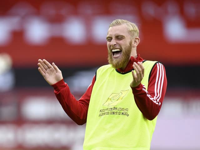 IMPROVEMENT: Sheffield United's Oliver McBurnie has a joke during warm up at Bramall lane. Picture: Peter Powell/NMC Pool/PA