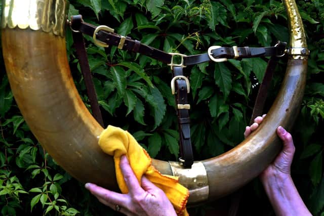Allison Clark one of the Ripon hornblowing team cleaning the 1865 horn at her home in Ripon. Image: Gary Longbottom